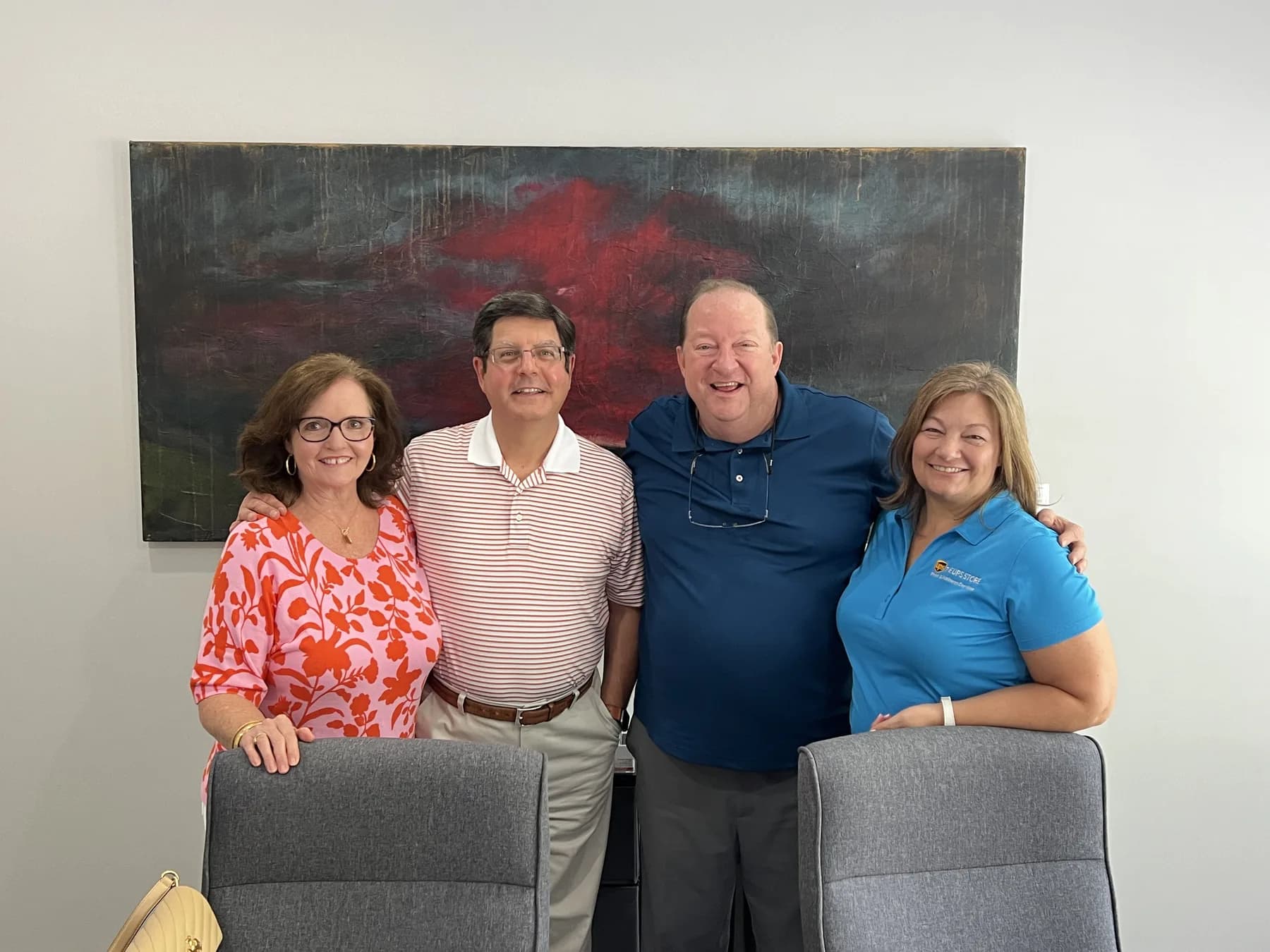 Jim McElroy with buyers and sellers after a business closing