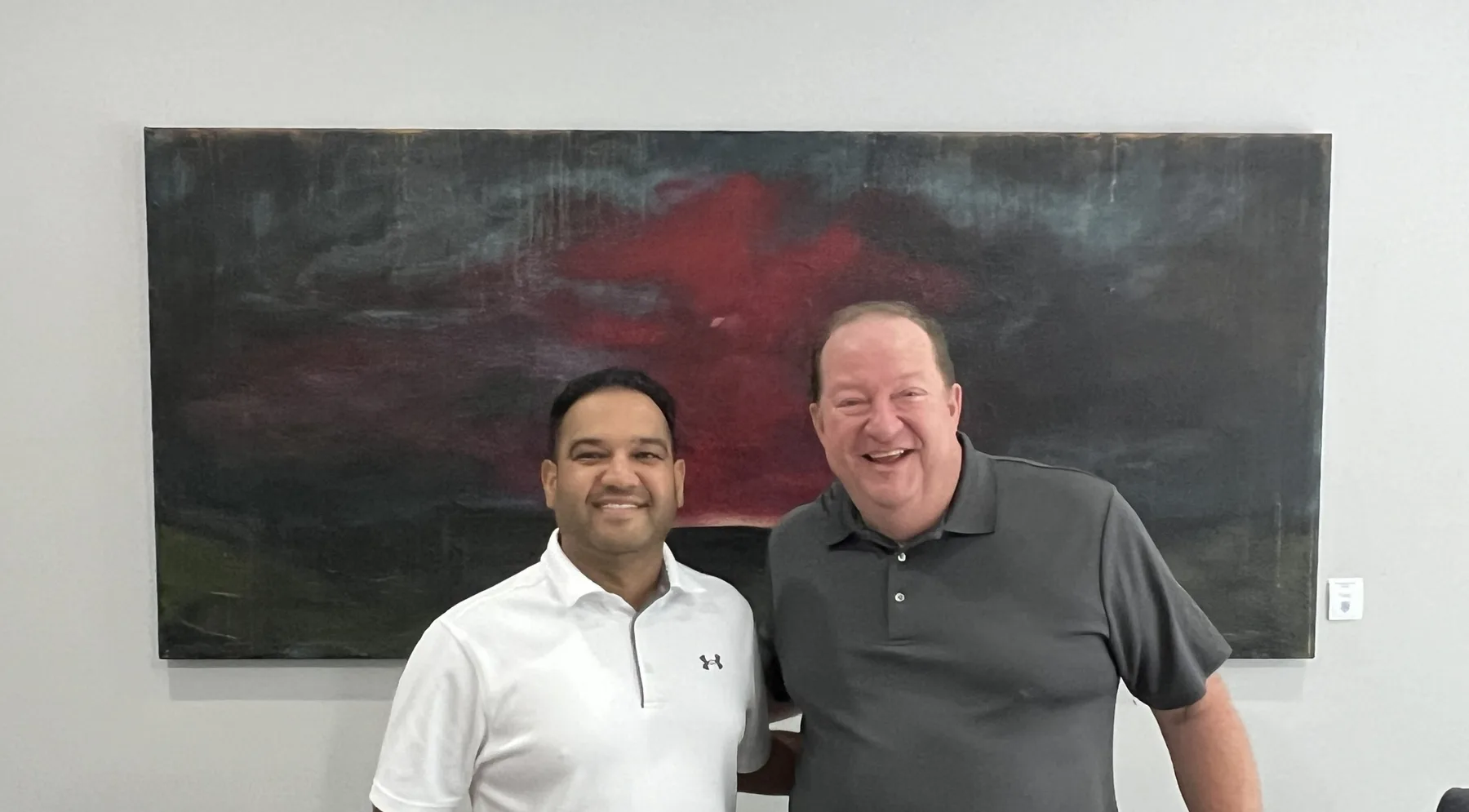 Jim McElroy with a store owner after closing