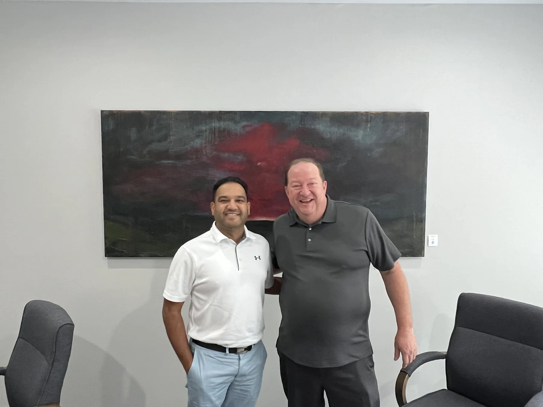 Jim McElroy and a store owner in a closing meeting room